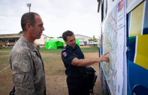 Emergency services personnel rely on paper maps during response planning, as seen here during the Pigeon Valley Fire event in February 2019. Credit: New Zealand Defence Force Facebook page.