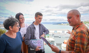 Toitū Te Whenua team meeting outside overlooking the Wellington waterfront