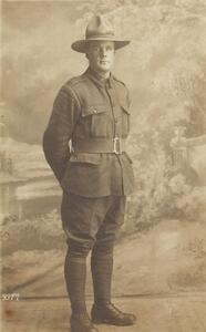 Portrait photo of John (Jack) Robert Murrell standing in uniform