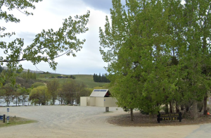 Rest area at Bonnock Burn, Lake Bannock with toilet block partially obscured by trees