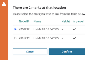 Image of a pop-up message alerting the user that there are 2 marks in the same location. The node IDs, and mark names are listed.