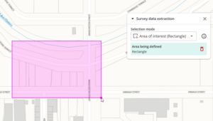 screenshot of spatial screen, with a pink rectangle being drawn. The survey data extraction panel shows "area being defined".