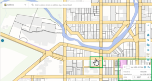 screenshot of spatial display. A parcel is selected at the bottom right of the screen, and its info panel is cut off by the screen extents. A mouse cursor is hightlighted to the left of the panel. The mouse cusror is a hand icon, indicating it is ready to drag the spatial display.