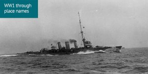 World War 1 through place names: A black and white photo of a ship surging through choppy water with smoke coming from its 3 funnel chimneys