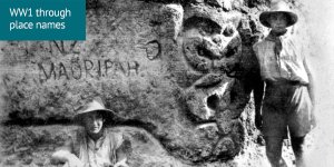 World War 1 through place names: 2 soldiers stand next to a trench wall with a po-style carving and the words NZ Maori Pah